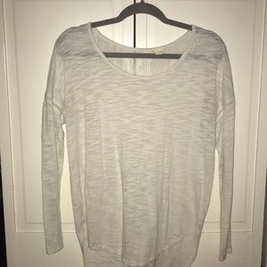 I am selling a white see through long sleeve shirt